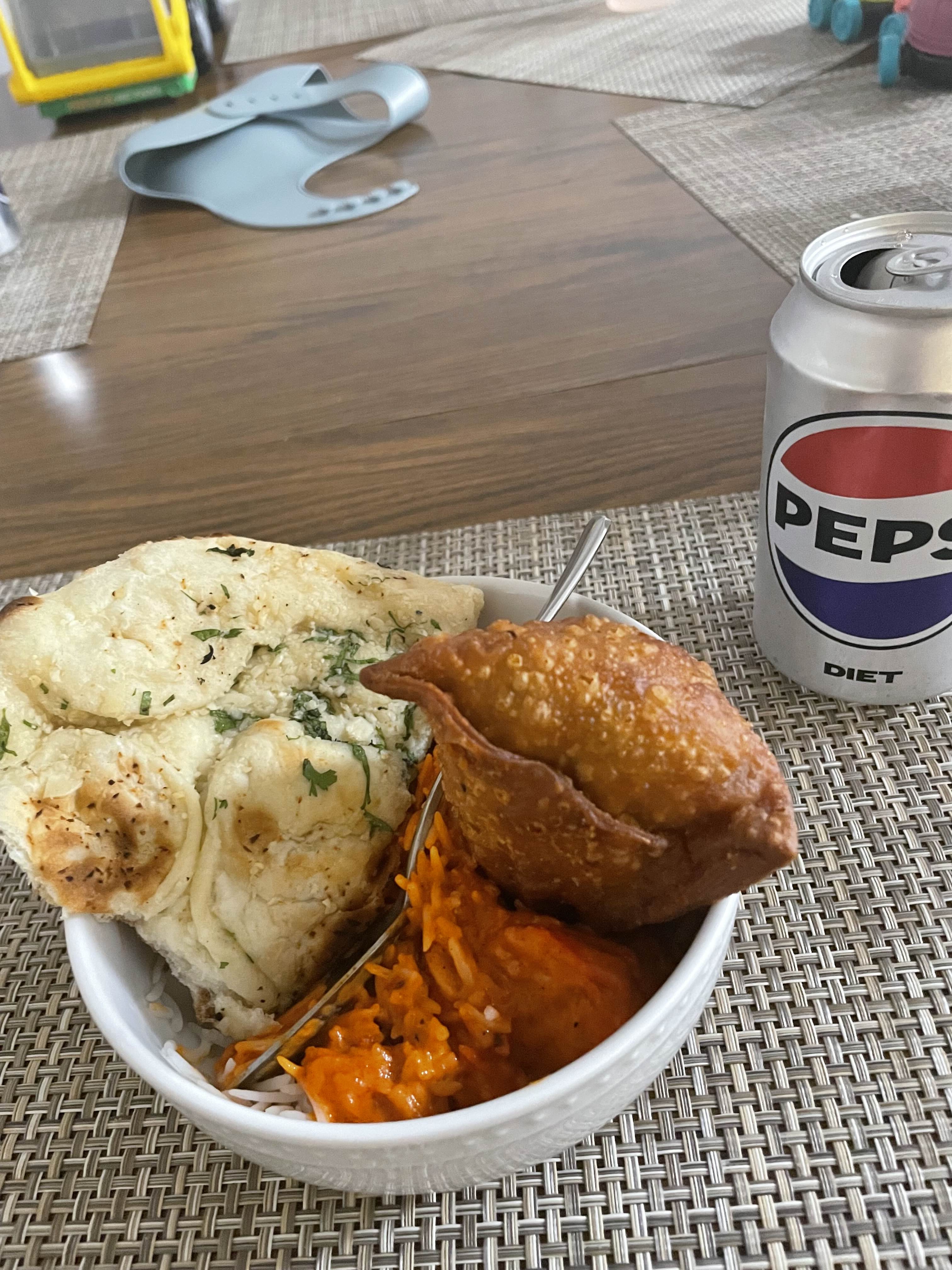 Nigerian rice and beans with puff puff