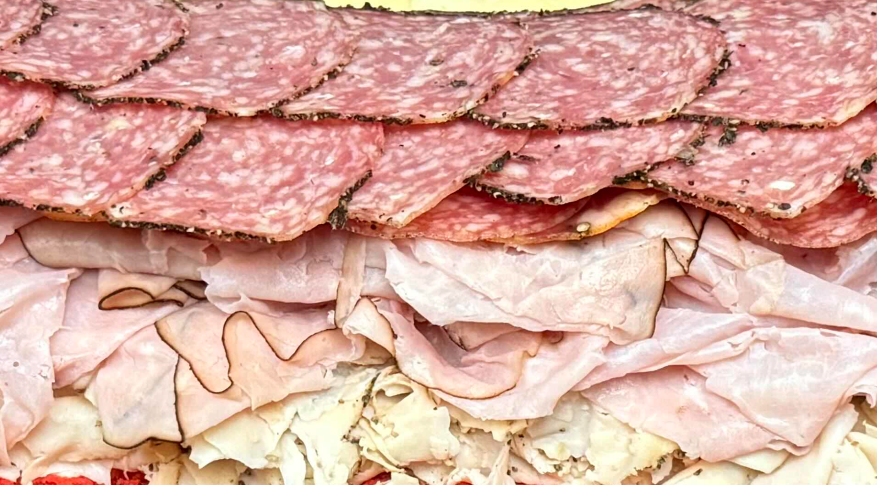 Hard to see, but its Shaved Pepper Turkey, Black Forrest Ham, Soppressata, GABAGOOL, and Peppered Salami on a homemade loaf.
I'm also wildy impressed with this camera's resolution because this picture was taken from like 10 feet away on digital zoom.