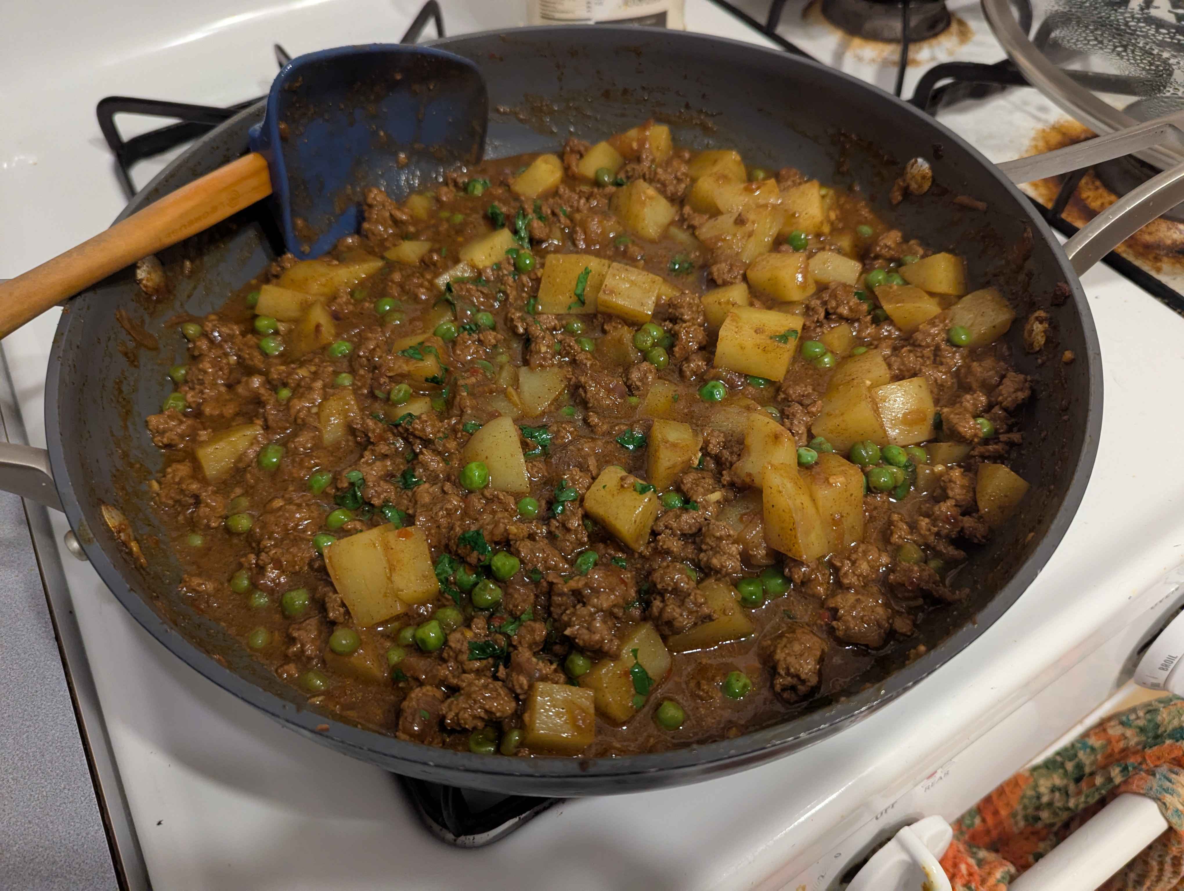 Ground lamb vindaloo kinda thing with potatoes and peas