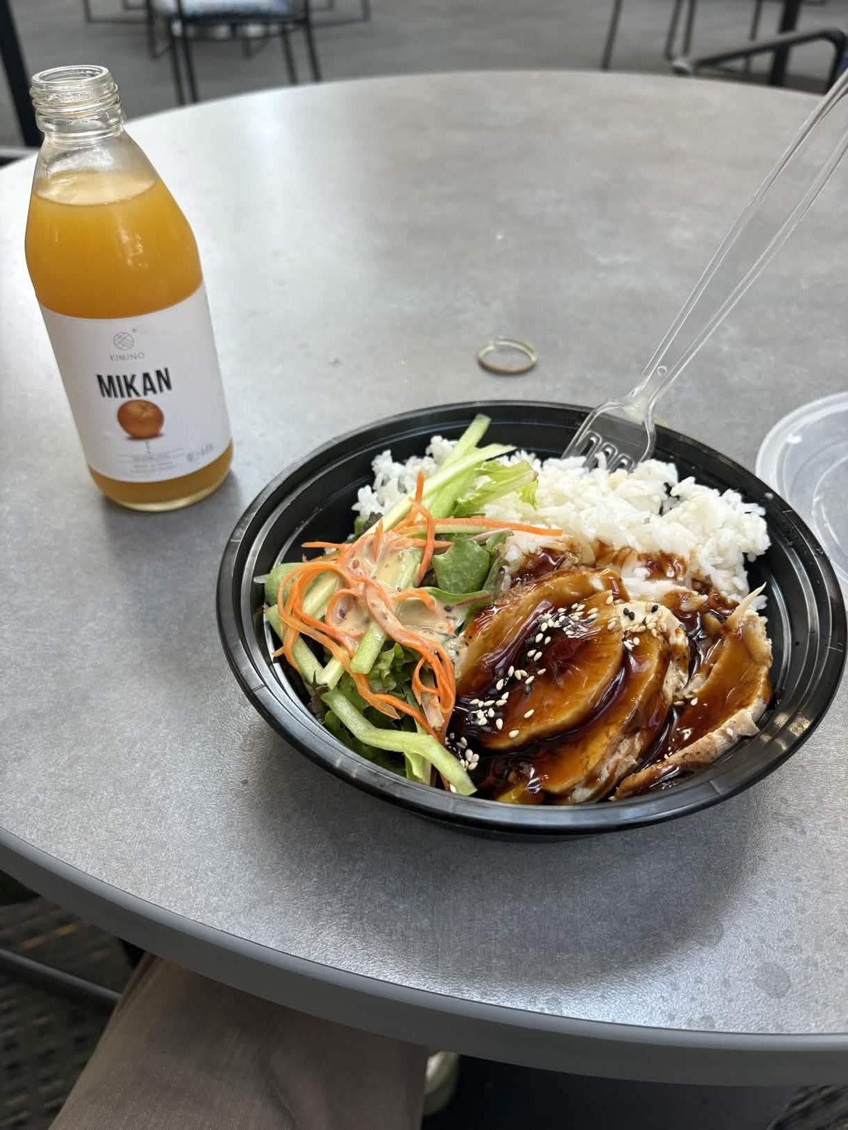 Chicken teriyaki with an orange  drink