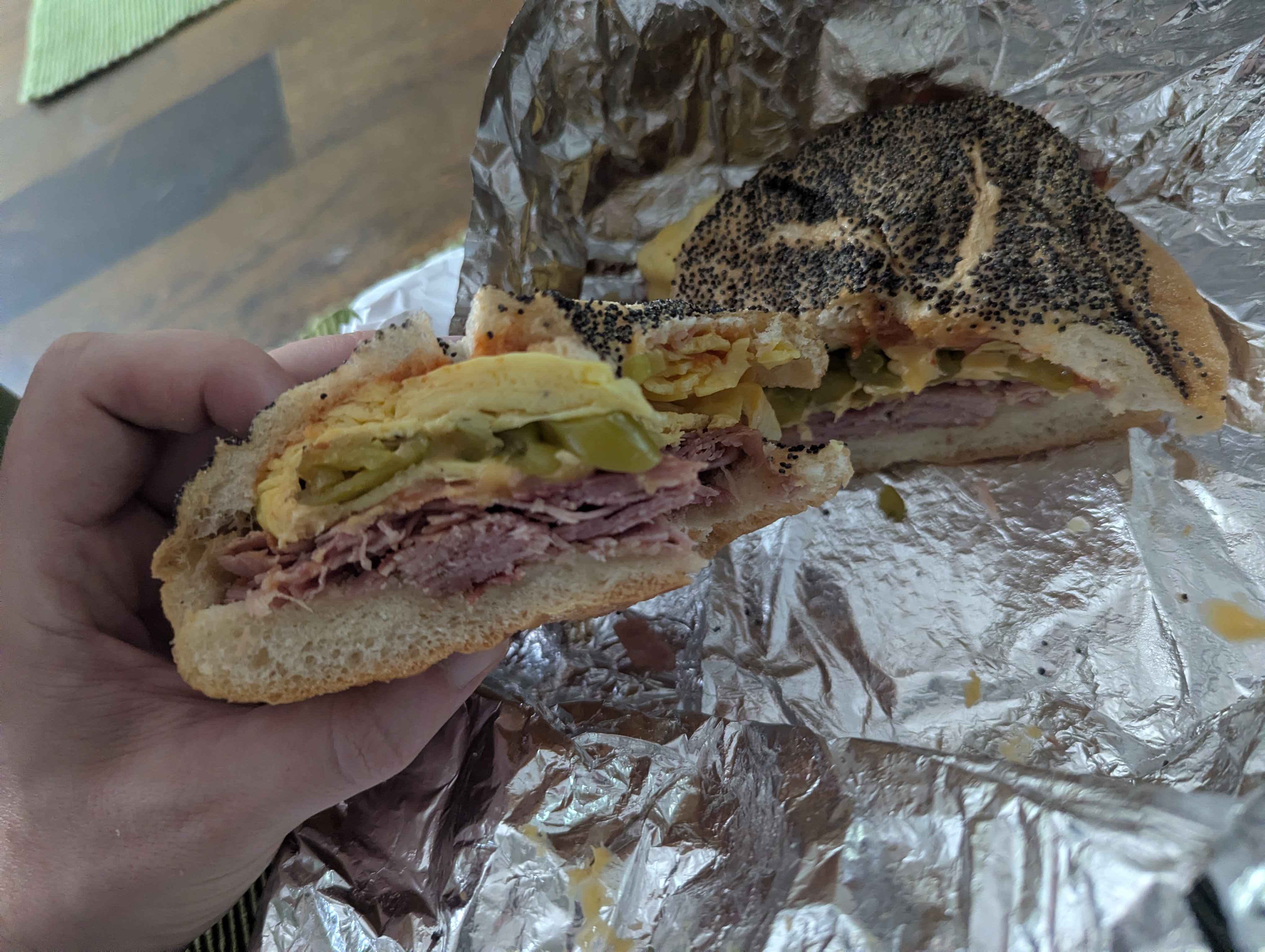 Deli sandwich on poppy seed bun