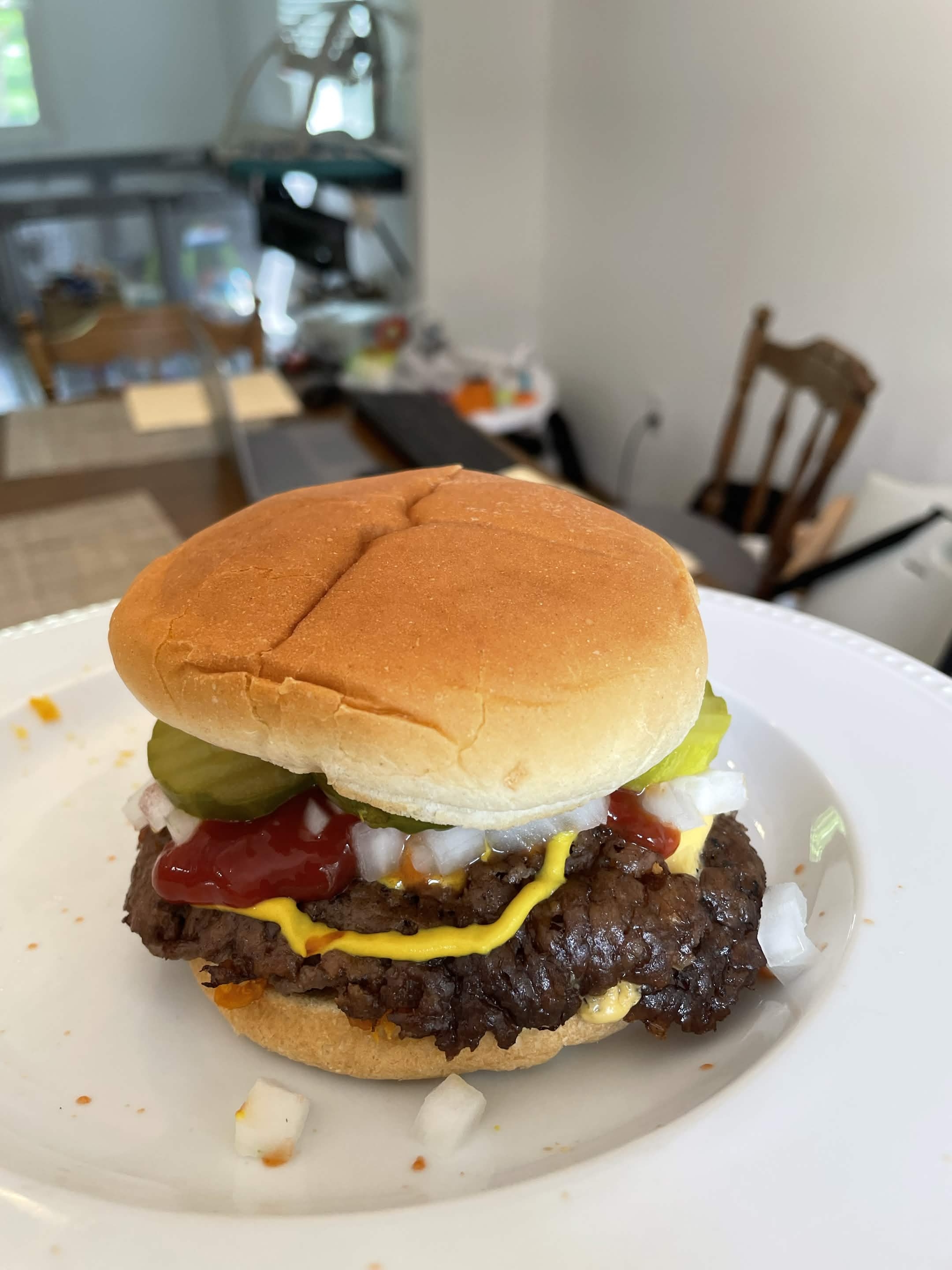 Cheeseburger with pickles onions