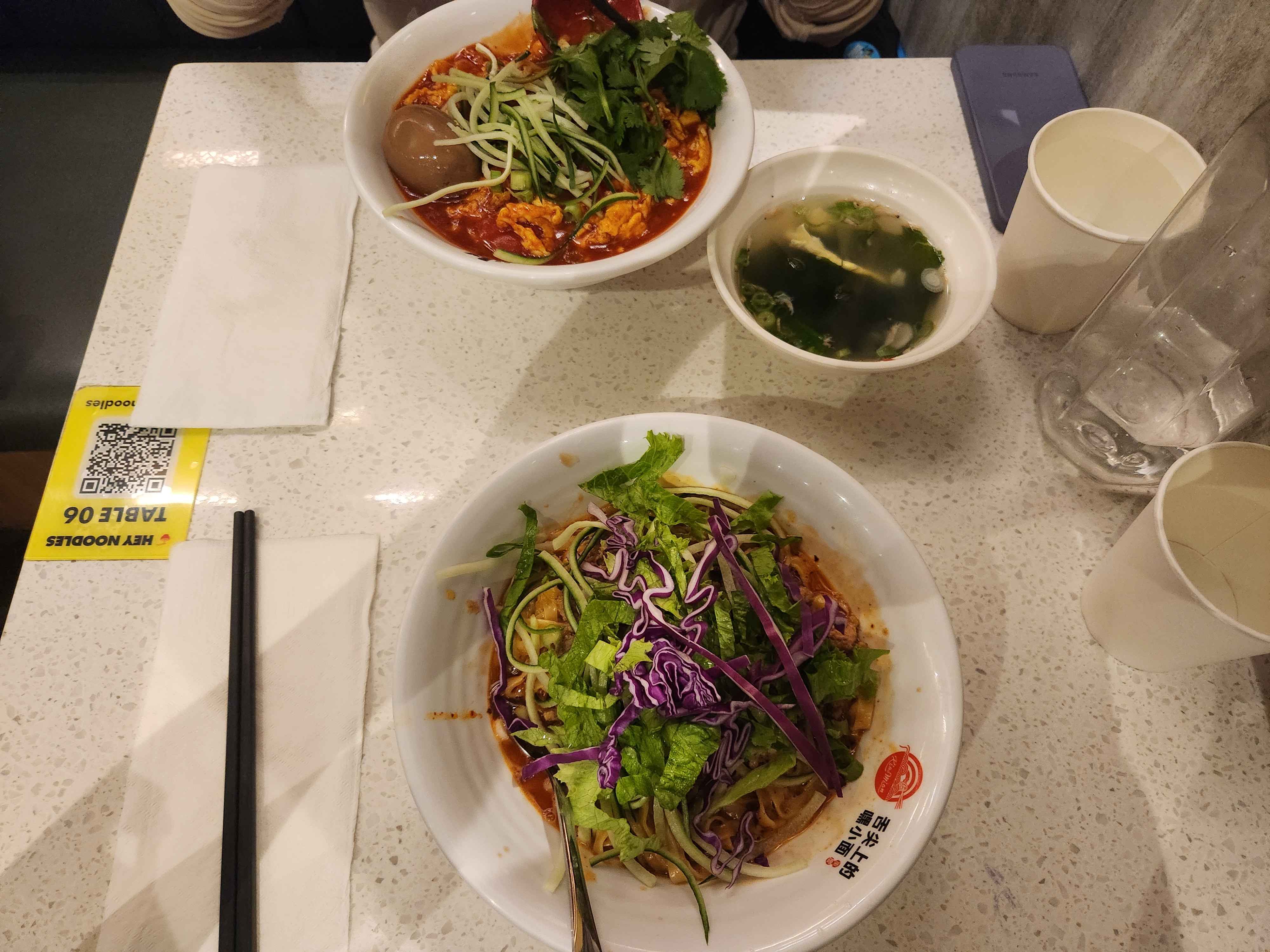 Top dish: Spicy noodle soup  
Bottom dish: Cold noodles with vegetables