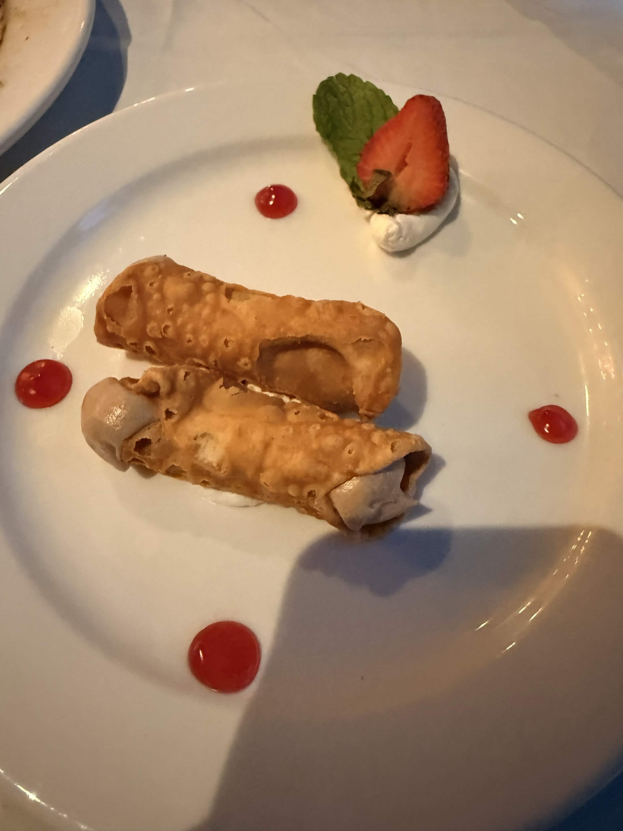 Cannoli with strawberry garnish