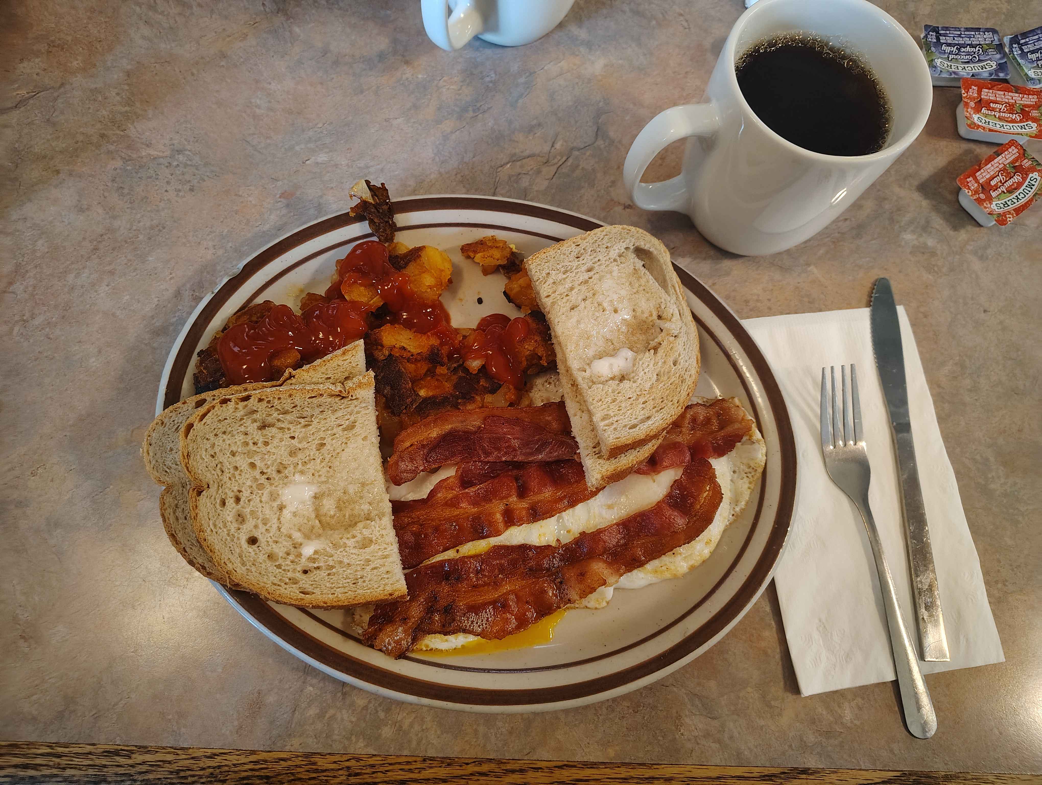 Home fries toast eggs and bacon, coffee