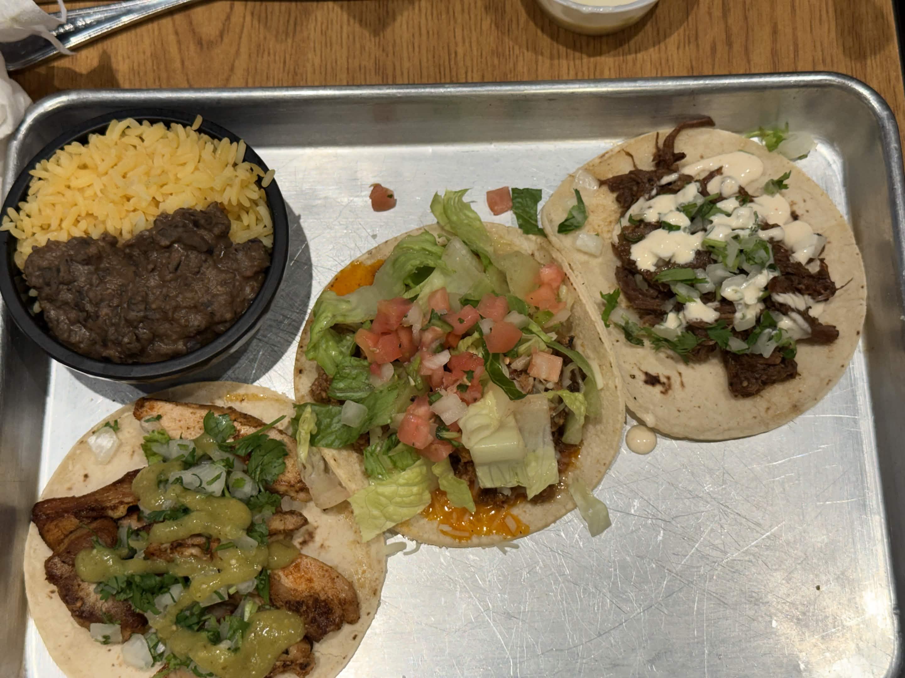 Three tacos with rice and beans (2)