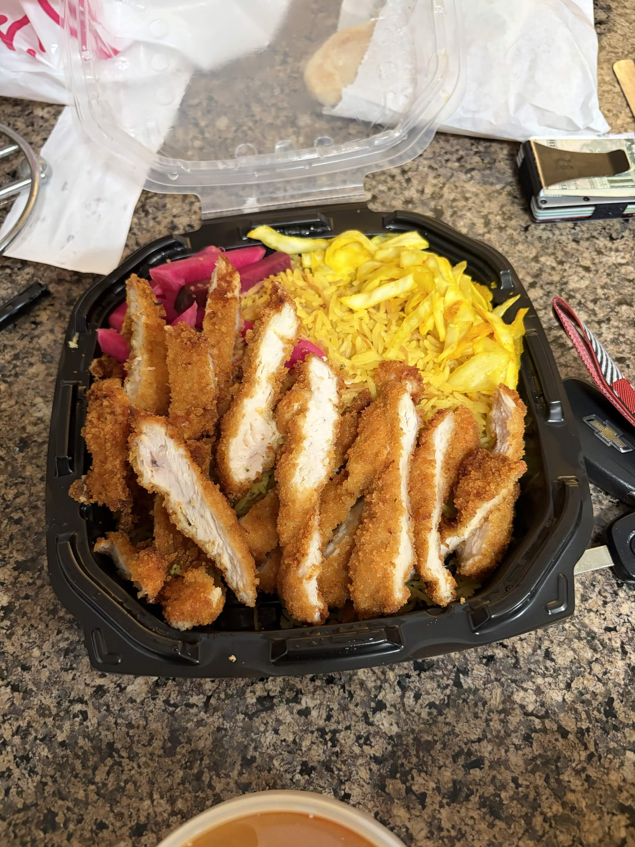 Chicken schnitzel with rice and pickles