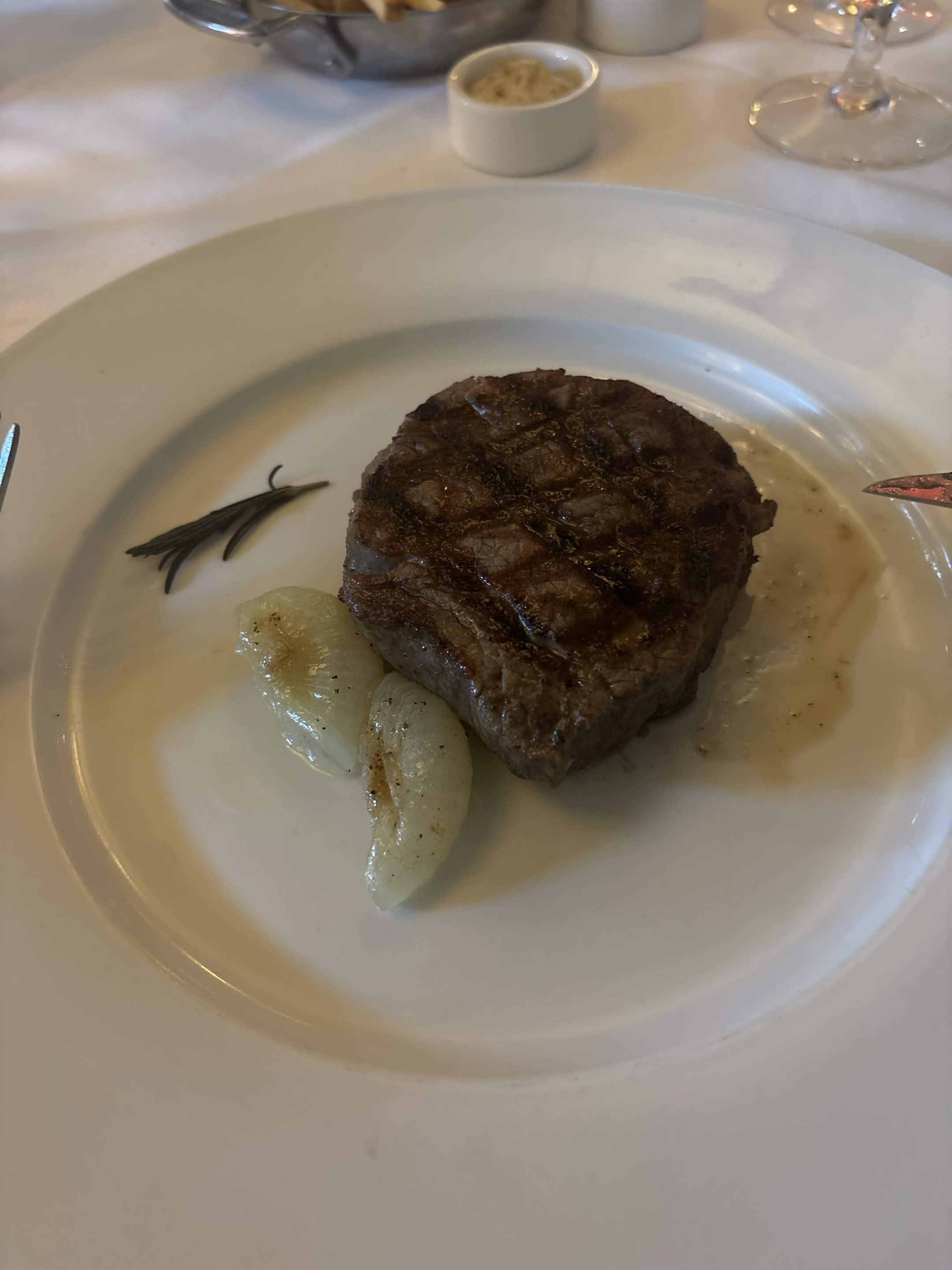 Grilled steak with onions