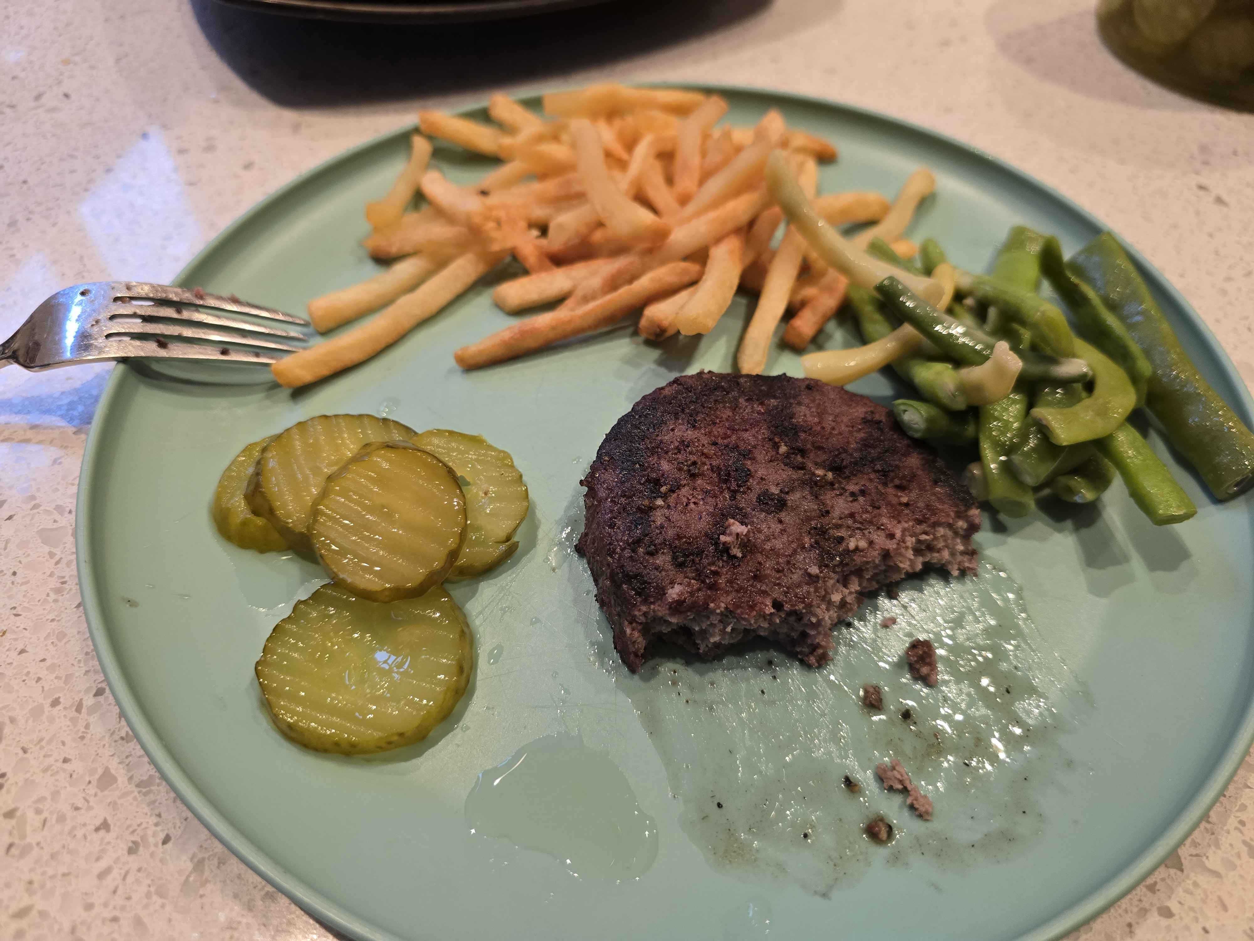 Burger patty fries pickles beans