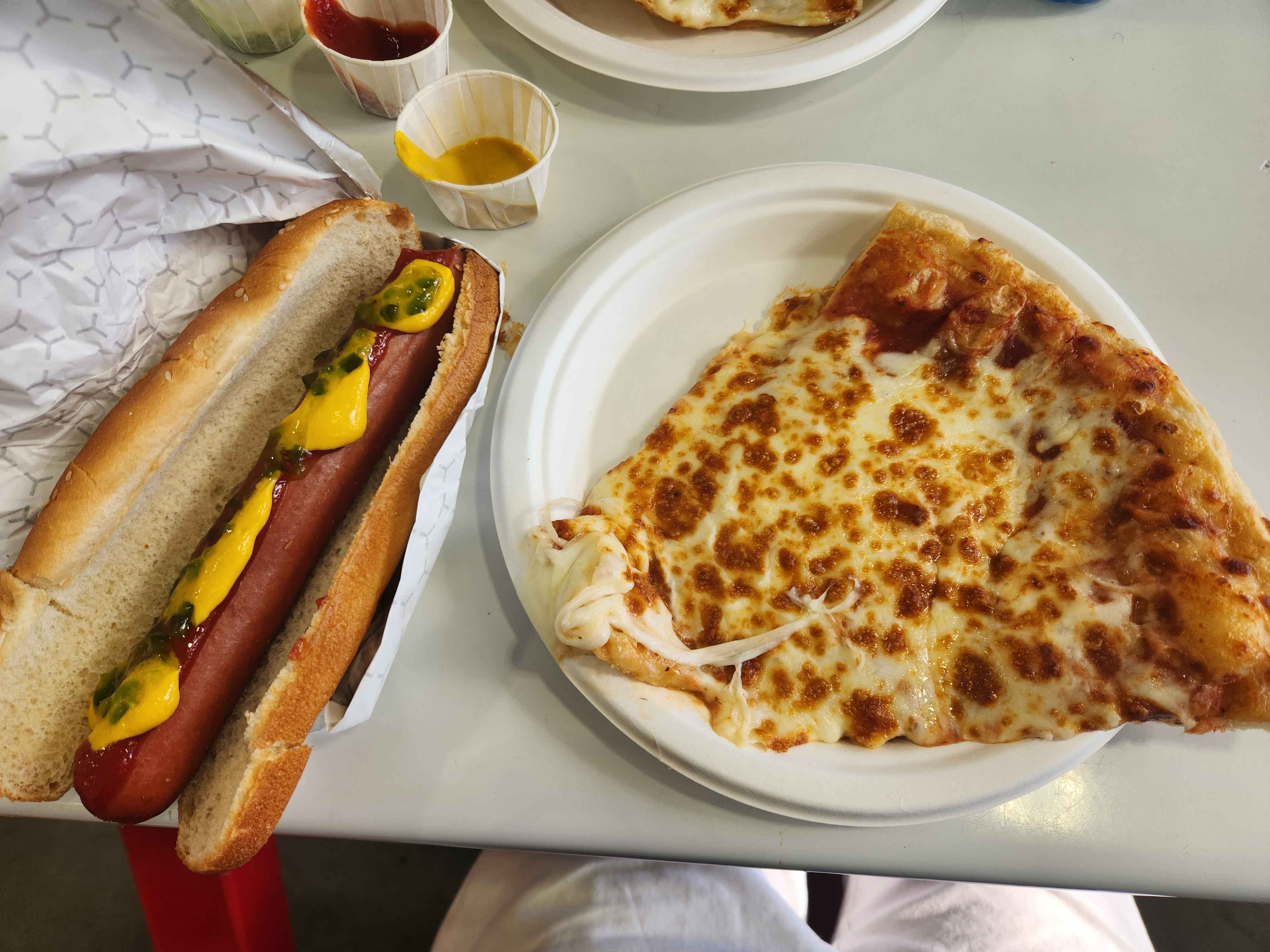 Hot dog and cheese pizza slice